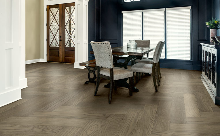 herringbone pattern hardwood flooring in dining room